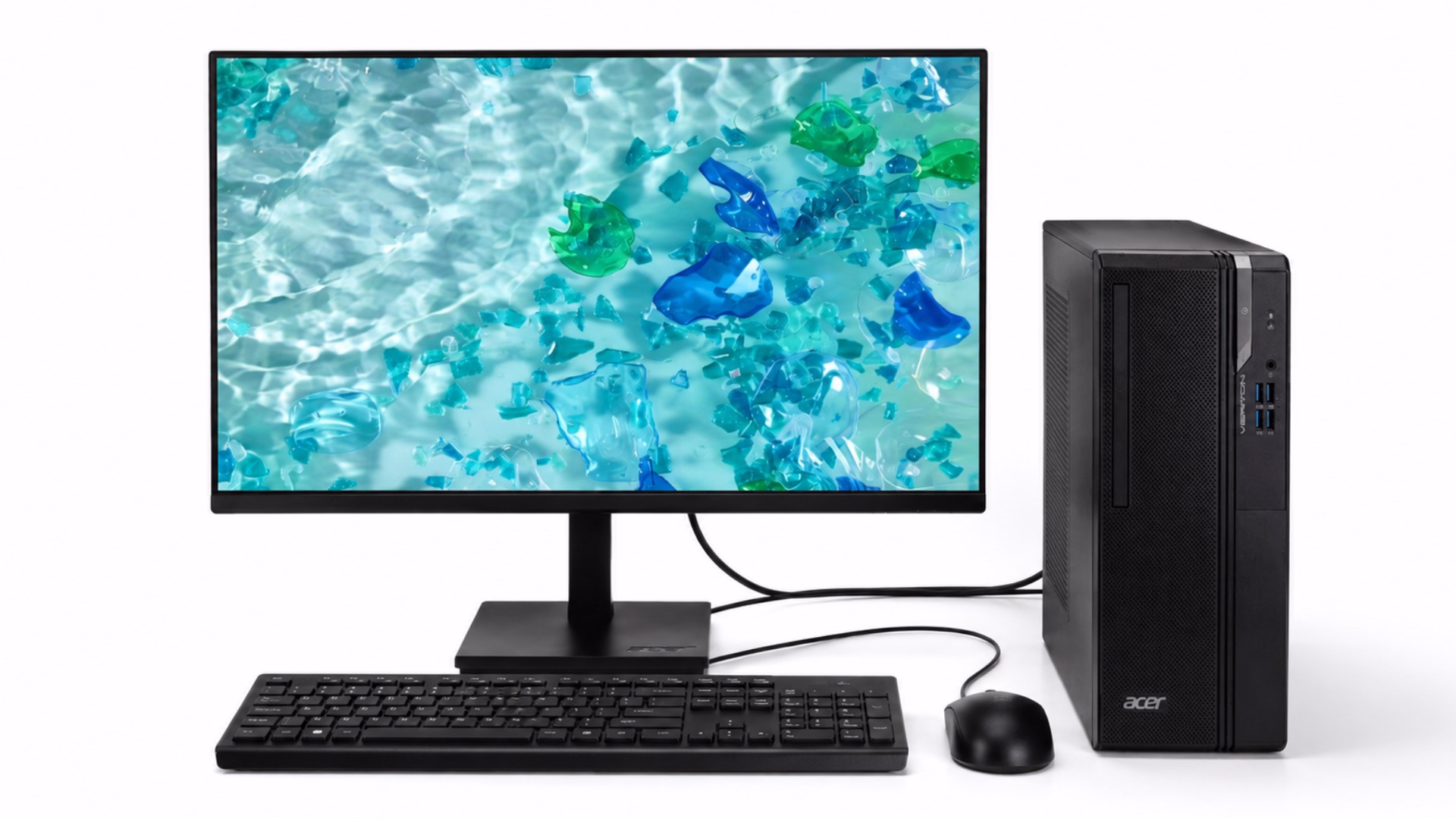 ชุดคอมพิวเตอร์ PC Acer Veriton S2722G ประกอบด้วยเคสคอมพิวเตอร์ จอภาพ คีย์บอร์ด และเมาส์ วางบนพื้นหลังสีขาว หน้าจอแสดงภาพกราฟิกโทนสีฟ้าและสีเขียว เชื่อมต่อสายสัญญาณระหว่างจอกับตัวเครื่อง