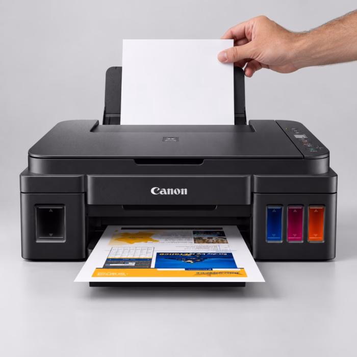 canon-pixma-g2010-aio-printer-4 การใส่กระดาษลงในถาดป้อนกระดาษด้านหลังของเครื่องพิมพ์ Canon PIXMA G2010 ขณะกำลังพิมพ์เอกสารสี